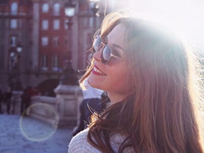 A Girl in Sunglasses Smiling