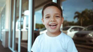 child smiling for dental crown