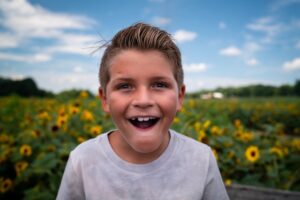 Young boy with big white smile