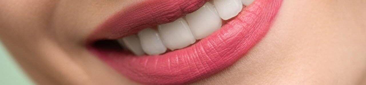 lady smiling with pink lipstick